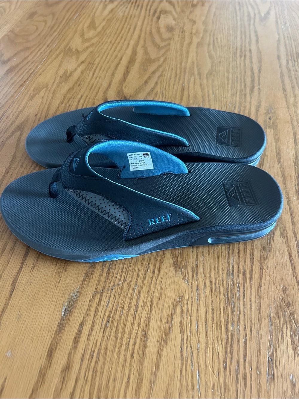 Reef Black and Teal Men’s Cushioned Flip Flops